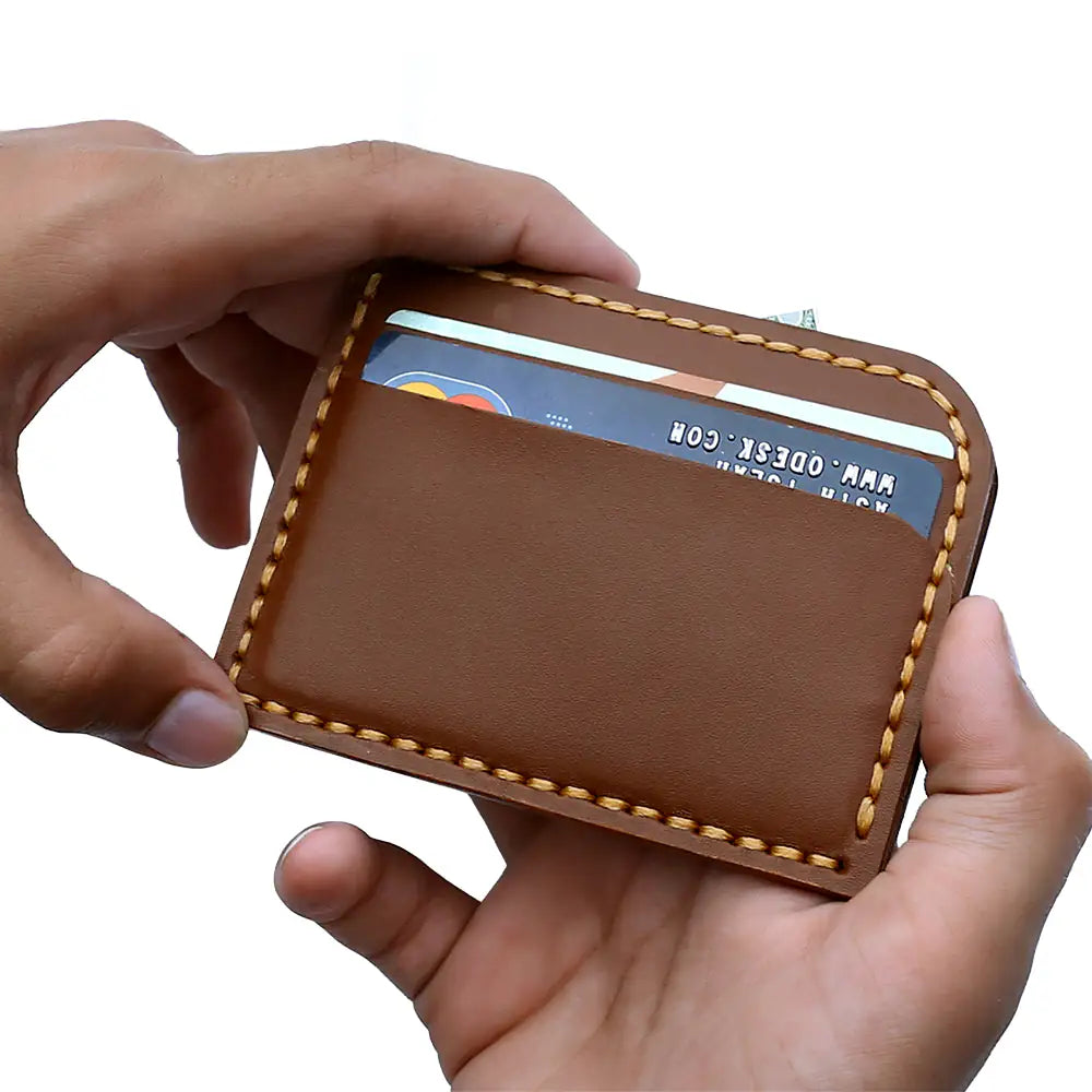 Brown leather cardholder with light contrast stitching, shown on a plain white background.