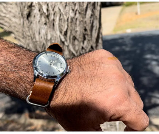 a person wearing a nato watch band