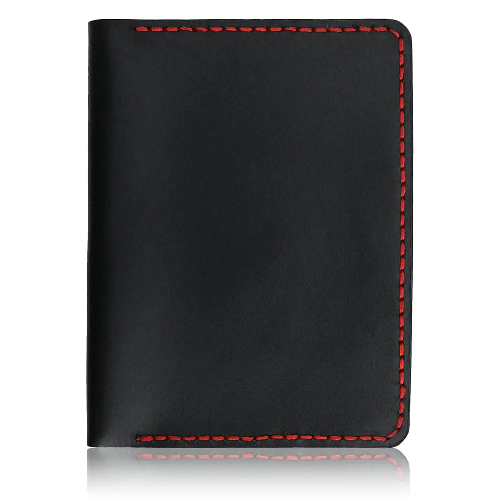 Overhead studio view of an open tan full-grain leather bifold cardholder, showcasing the symmetrical interior card slots and premium saddle-stitched edges, isolated on a white background with a soft natural shadow.