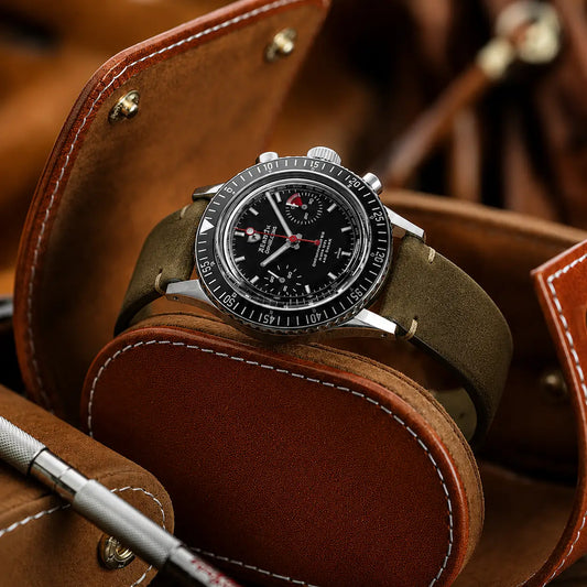 22mm military green suede leather watch strap paired with Rolex Explorer II chronograph watch, premium handcrafted vintage watch band with rugged styling.