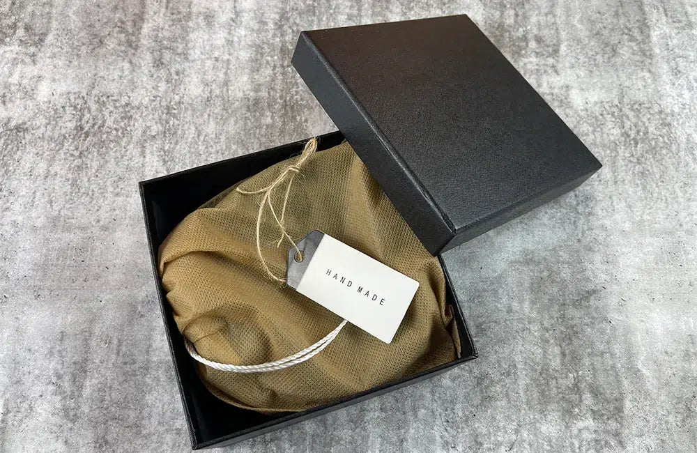 Brown leather men’s belt packaged with a black presentation box for gifting and storage.