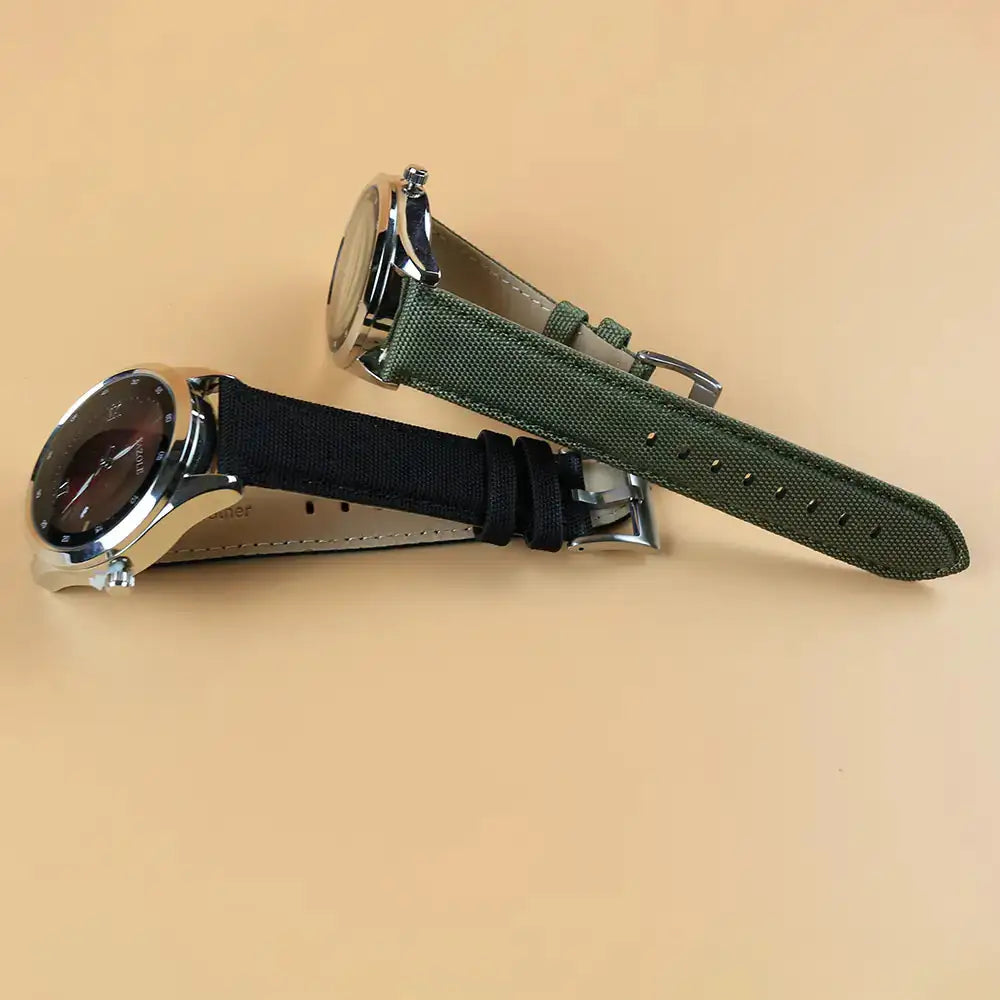 Black And Green Watch Straps Attatched to Dials