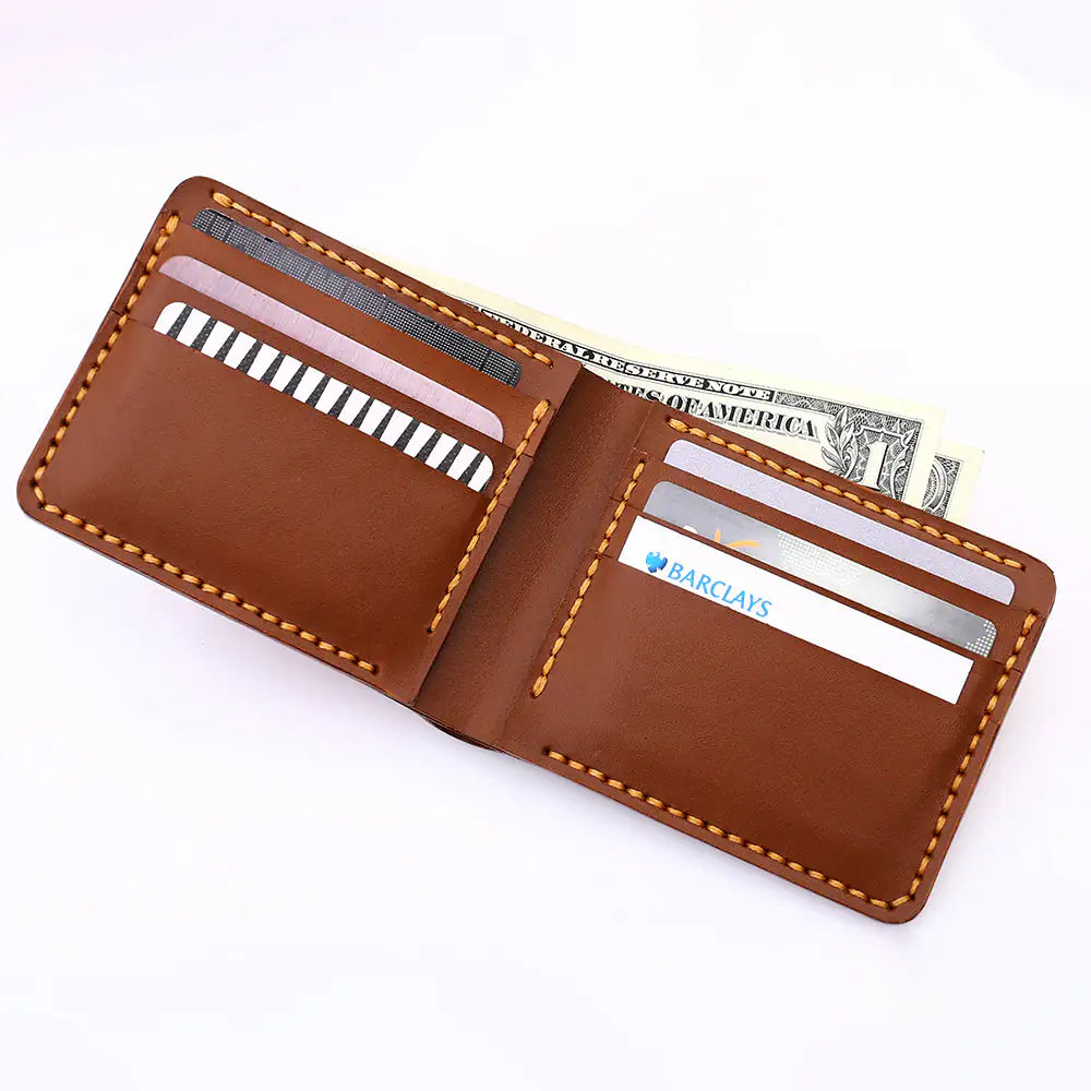 Interior flat-lay of the handmade bifold in a rich tan leather, showcasing the authentic grain texture and natural creases of the vegetable-tanned hide without reddish undertones, featuring precision-cut card slots for a high-value minimalist aesthetic.