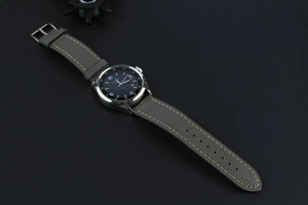 Grey Epsom Leather Watch Strap in a display with a watch