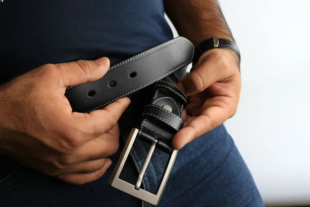 a person holding a belt