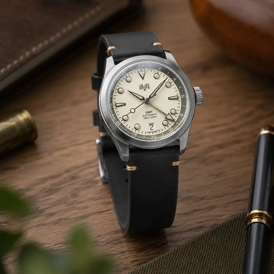 20mm Black Italian leather watch strap paired with Christopher Ward GMT watch, handcrafted premium watch band with contrast stitching and vintage-inspired styling.