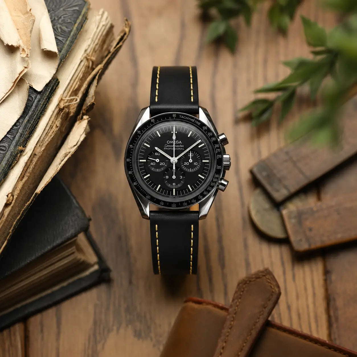 20mm Black Italian leather watch strap paired with Omega Speedmaster Professional, handcrafted premium watch band with contrast stitching and vintage styling.