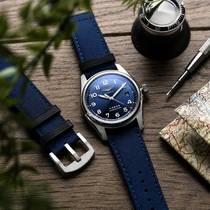 22mm blue canvas quick-release watch strap on Longines Spirit watch, durable premium watch band with textured fabric finish and versatile everyday style.