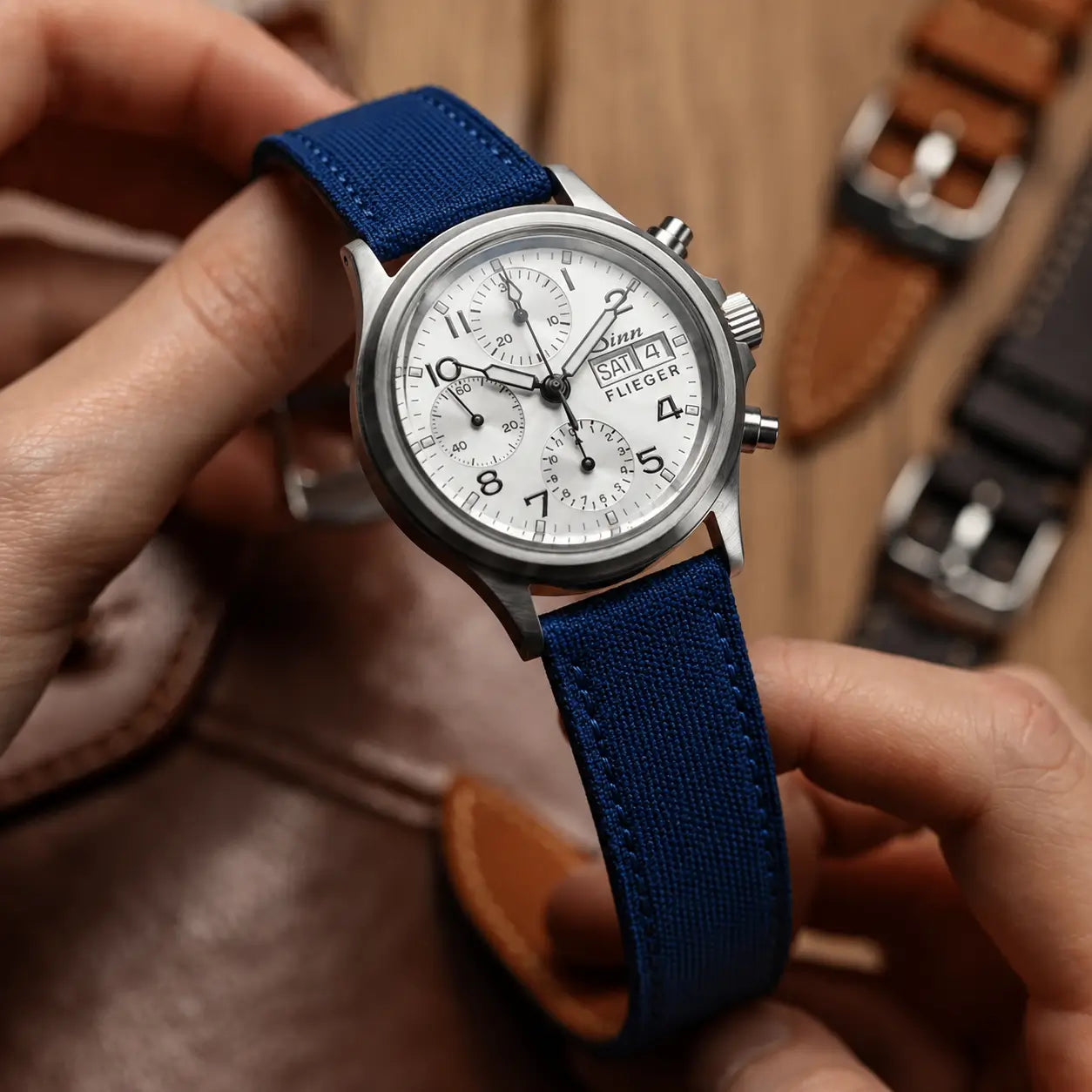 20mm blue canvas watch strap on Sinn Flieger chronograph, handcrafted quick-release watch band with aviation-inspired design and modern casual appeal.