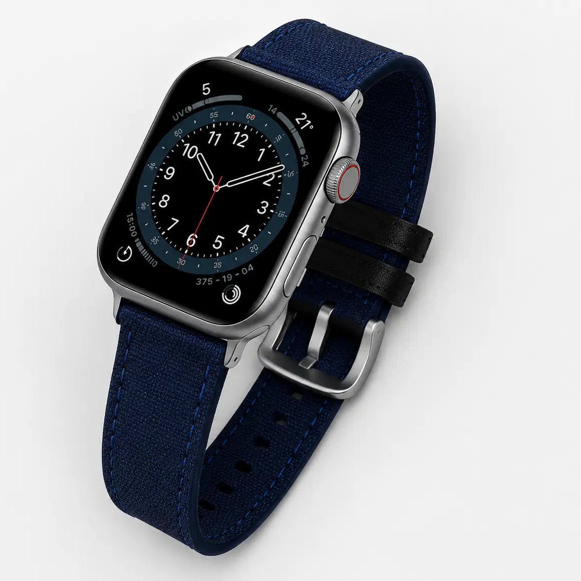 Close-up studio shot of a modern smartwatch with a deep navy blue fabric-texture strap and matching blue stitching. The watch is displayed on a clean light background to emphasize material detail, premium finish, and silver hardware.