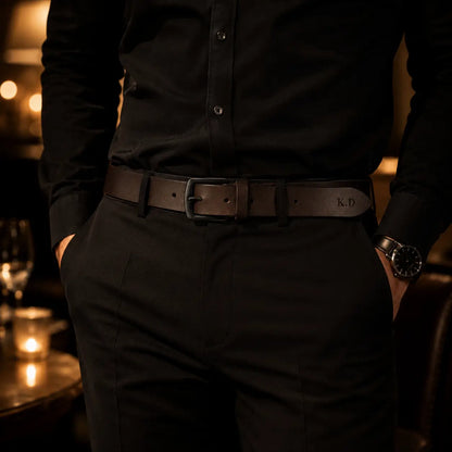 Men’s black leather belt worn with black trousers in an evening smart casual outfit