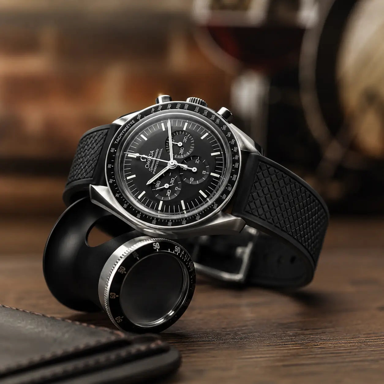 20mm black FKM rubber watch strap on Omega Speedmaster Professional, premium textured performance watch band with flexible waterproof comfort and modern sport styling.
