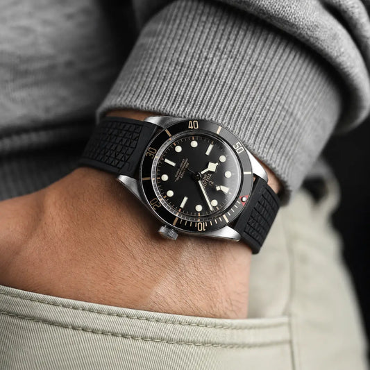 22mm black FKM rubber watch strap on Tudor Black Bay Fifty-Eight, textured waterproof sport watch band shown on wrist for rugged everyday and dive-ready wear.