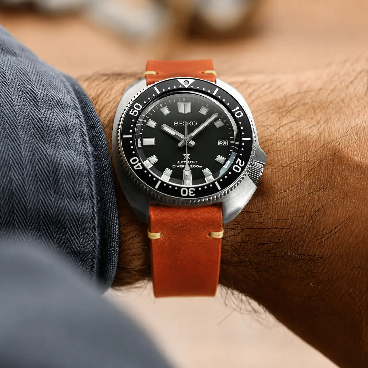 22mm frosted tan leather watch strap on Seiko Prospex diver watch wrist shot, handcrafted vintage-style leather watch band with rugged everyday styling.