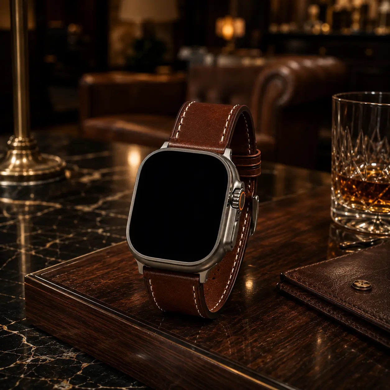 Fashion-style product photograph of Apple Watch Ultra fitted with a brown leather strap positioned on polished marble and dark wood surfaces inspired by a five-star hotel lobby. Warm ambient lighting and elegant reflections emphasize premium materials and craftsmanship while preserving the strap’s original color and the watch’s black inactive screen.