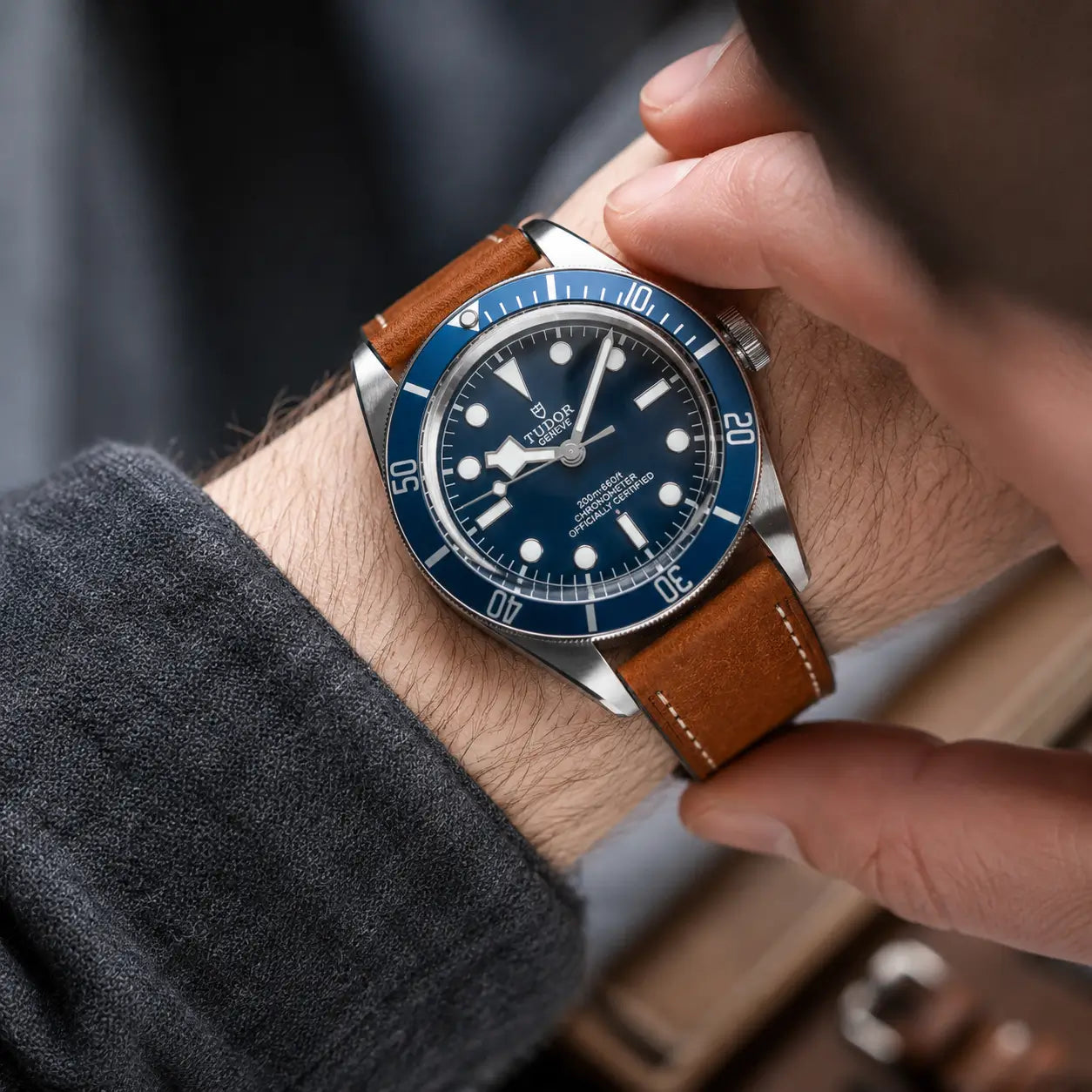 22mm Brown Italian Pueblo leather watch strap paired with Tudor Black Bay watch on wrist, handmade premium leather watch band with vintage styling.