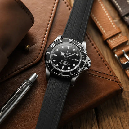 20mm black rubber watch strap on Rolex Submariner, textured waterproof performance watch band with sporty design and all-day comfort for luxury dive watches.