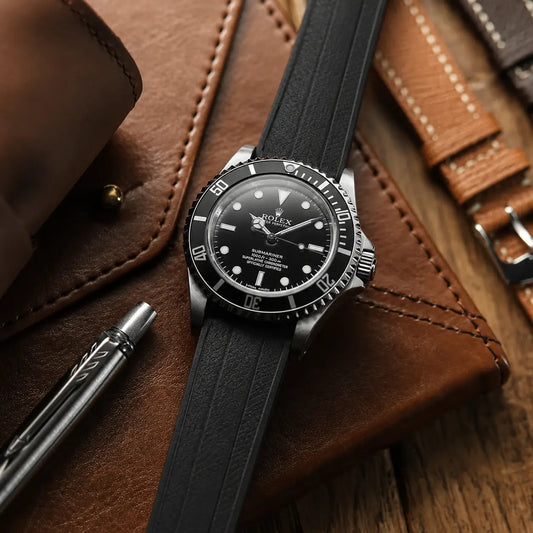 20mm black rubber watch strap on Rolex Submariner, textured waterproof performance watch band with sporty design and all-day comfort for luxury dive watches.