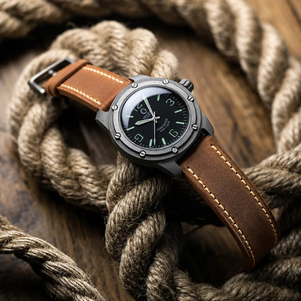 22mm Brown leather watch strap paired with tactical-style field watch, handcrafted premium watch band with contrast stitching and rugged outdoor styling.