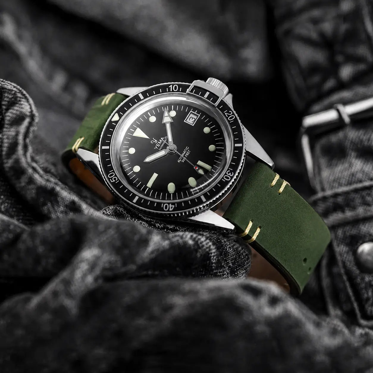 20mm olive green leather watch strap fitted to Yema Superman dive watch, handcrafted vintage leather watch band with rugged heritage styling.