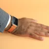 A man wearing Orange Vegetable Tanned Leather Apple Watch Band