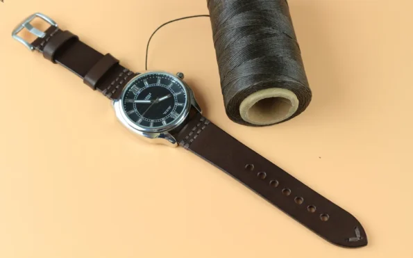 Dark brown vegetable tanned Leather watch strap is showing the quality of thread to make the strap