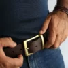 a man wearing a leather belt