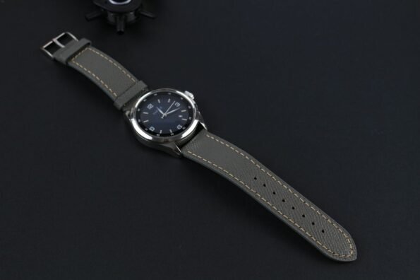 Grey Epsom Leather Watch Strap in a display with a watch