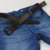 a pair of blue jeans with a black belt