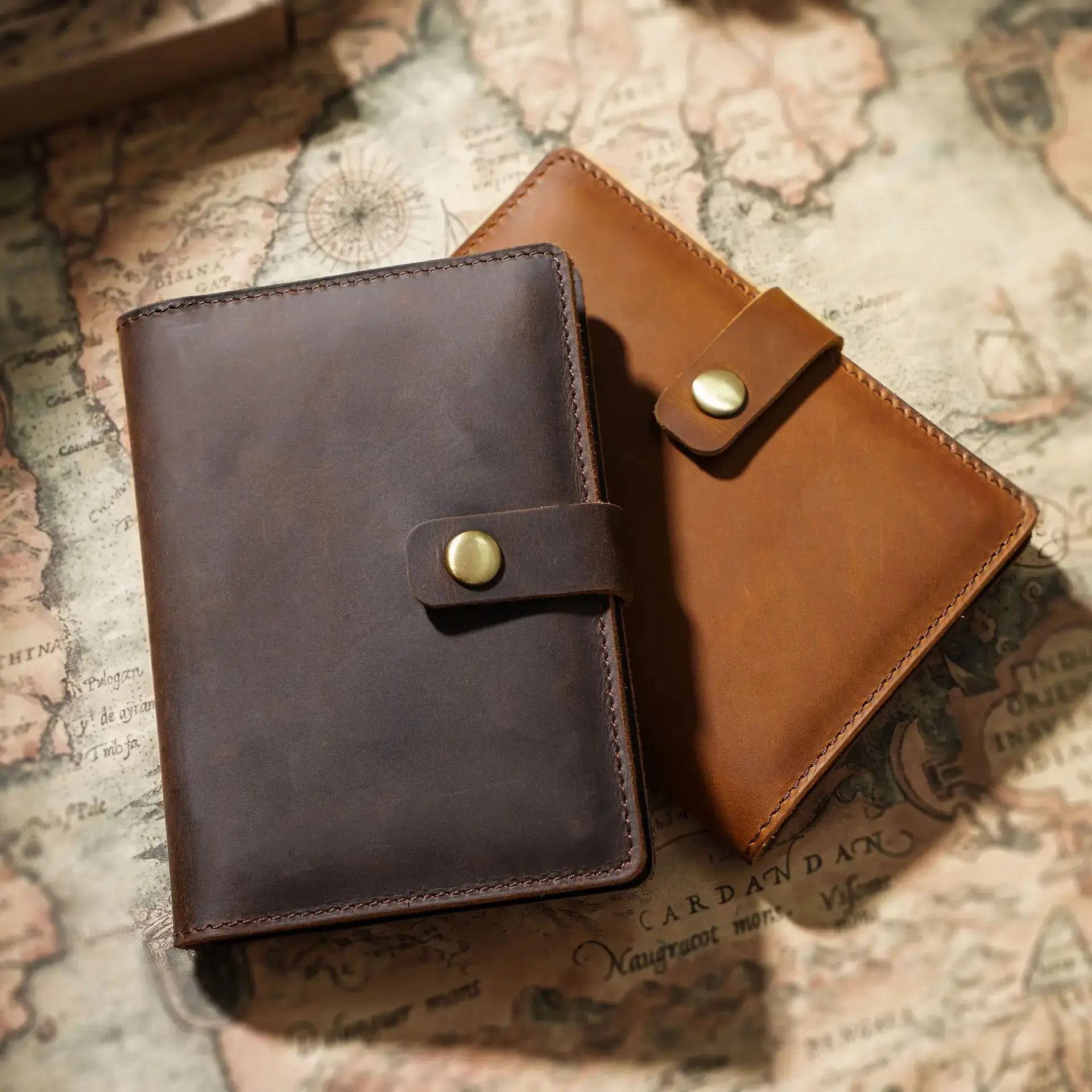 Brown and dark brown passport holders