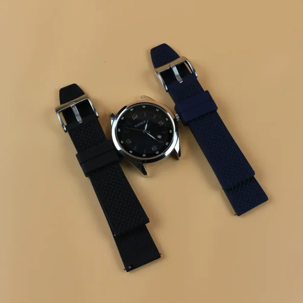 Both Colours of Rubber Watch Strap next to dial